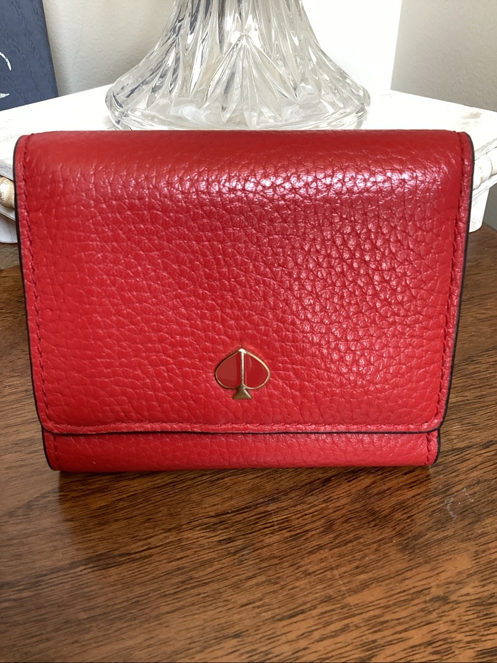 Kate Spade red pebbled leather Kayla small zip wallet with spade logo